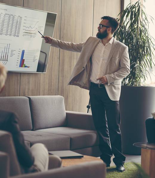 Business team on a morning briefing; business meeting and presentation in a modern office